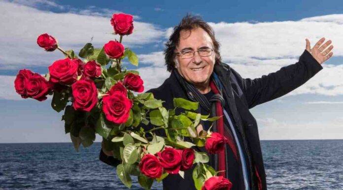 Al Bano con delle rose in mano