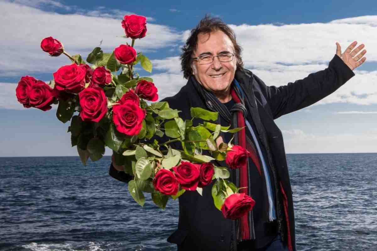 Al Bano con delle rose in mano